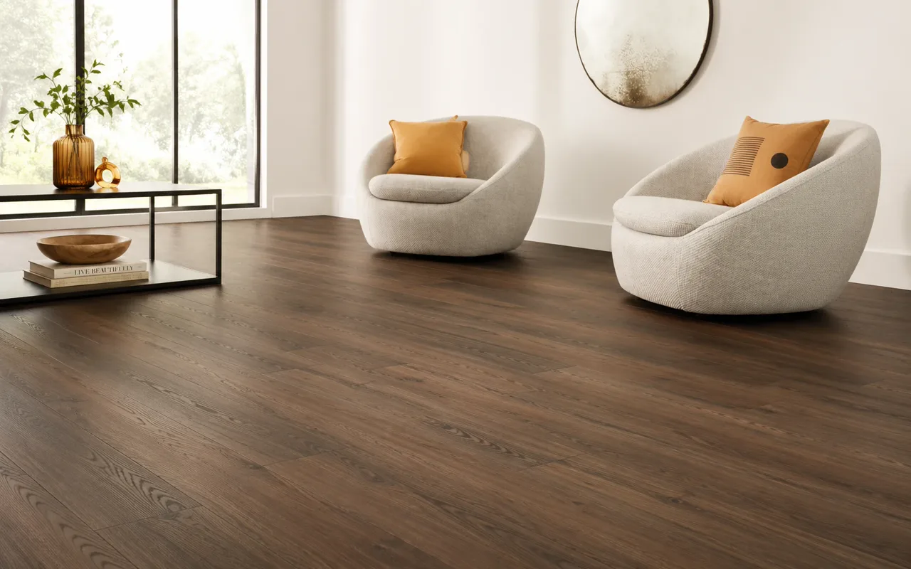 Dark engineered hardwood flooring in a bright sitting room